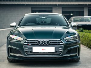 Elegant Audi S5 front view showcasing modern design and sporty features in daylight.