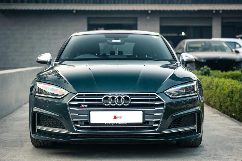 Elegant Audi S5 front view showcasing modern design and sporty features in daylight.